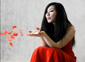 Blowing feathers, red feathers, girl, red dress, lovely, beauty HD wallpaper