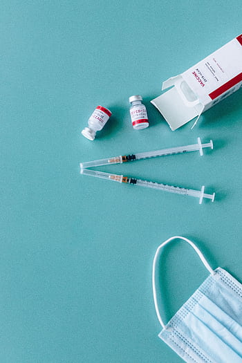 Syringes, vaccine vials, and face mask ready for COVID-19 vaccination. HD phone wallpaper