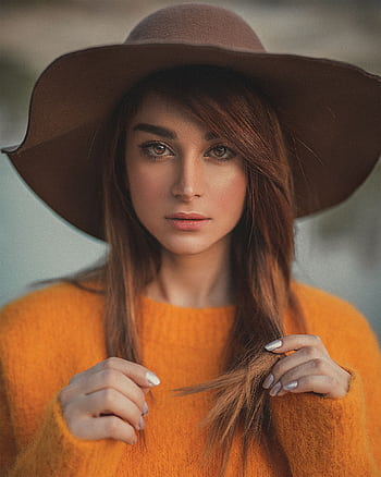 Elegant portrait of a woman in a hat and sweater outdoors in Paris. HD phone wallpaper