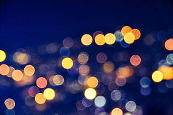 A dazzling display of colorful bokeh lights creating a stunning abstract background. HD wallpaper