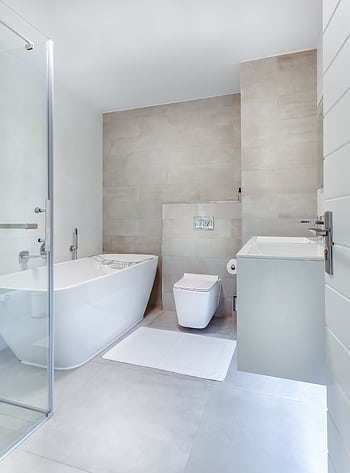Elegant minimalistic bathroom featuring bathtub and sleek fixtures. HD phone wallpaper