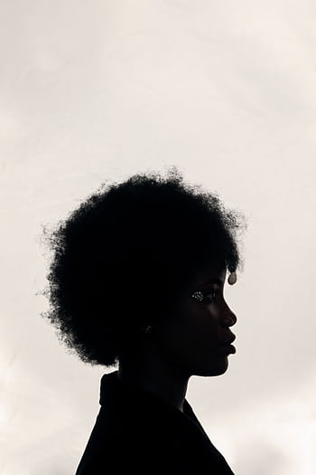 Side view silhouette of a woman with afro hair against a cloudy sky. Elegant and serene mood. HD phone wallpaper