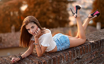 Beautiful Red Head Model, brick wall, louboutin, denim shorts, blue eyes, off shoulder white top, red hair, jewelry, black heels HD wallpaper