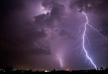 Intense lightning strikes illuminate a stormy night sky over Tiruchirappalli, India. HD wallpaper