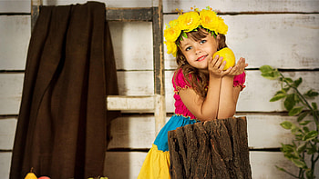 Beautiful Cute Little Girl Is Wearing Colorful Dress Leaning On Tree Trunk With Wreath Cute HD wallpaper