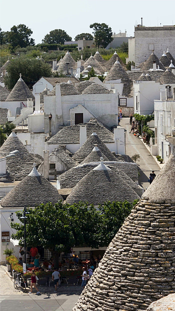 Exploring trulli houses, Alberobello's magical allure HD phone wallpaper