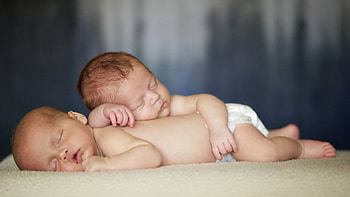 Two Cute Babies Are Sleeping On Cloth In Blur Background Cute HD wallpaper