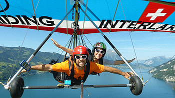 Hang gliding in Interlaken, Swiss adventure, Stunning Alpine scenery, Thrilling aerial experience HD wallpaper
