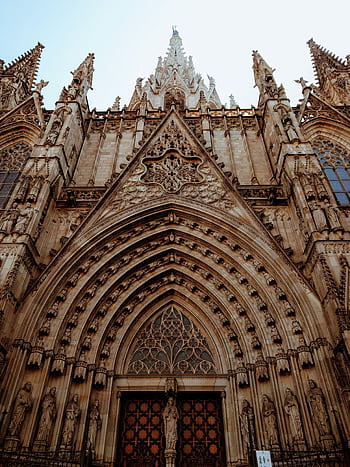 Intricate gothic architecture of the Barcelona Cathedral facade, a historic landmark in Spain. HD phone wallpaper
