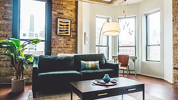 Contemporary living room with elegant decor and cozy furniture in urban setting. HD wallpaper