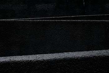 A dark and minimalist black texture pattern ideal for backgrounds and design use. HD wallpaper