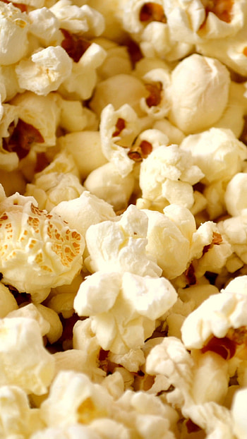 Tasty popcorn snack, Food , Popped corn kernels, Vibrant background HD phone wallpaper