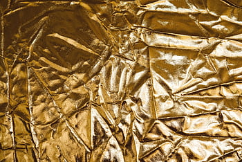 High-resolution of crumpled gold fabric, perfect for backgrounds and designs. HD wallpaper