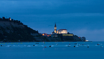 church in a seaside slovenian town in evening, sea, lights, coast, town, church, evening HD wallpaper