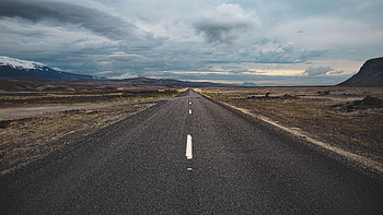 Road Between Snow Capped Mountain Hills Bushes Under Clouds Blue Sky Nature HD wallpaper