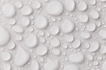 Close-up of abstract white water droplets on a smooth surface, ideal for background or texture. HD wallpaper