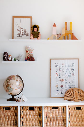 Charming child's room featuring toys, decor, and wicker storage baskets. HD phone wallpaper