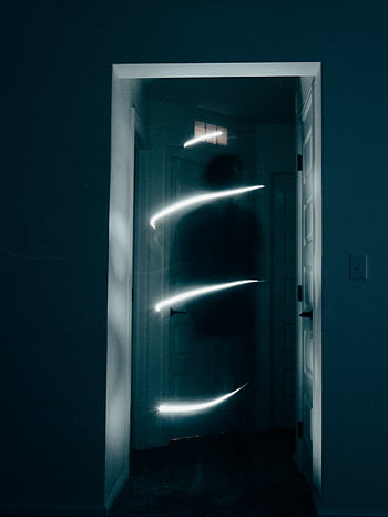 Mysterious hallway illuminated by swirling light, creating a ghostly ambiance. HD phone wallpaper