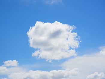 A clear summer sky with bright white cumulus clouds against a vivid blue backdrop. HD wallpaper