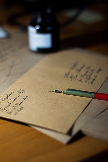 Close-up of vintage letters with a pen and ink, showcasing classic handwriting. HD phone wallpaper
