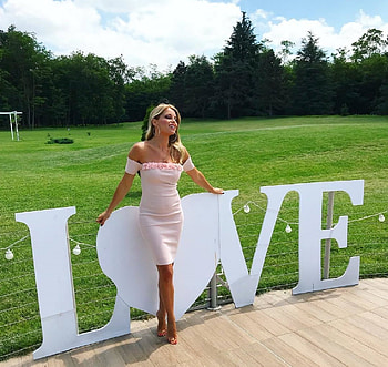Francesca Leto, white electric lights, blonde, love sign, bare feet, lage round earrings, off shoulder, neckline with matching roses, large green area, pale pink dress, trees HD wallpaper