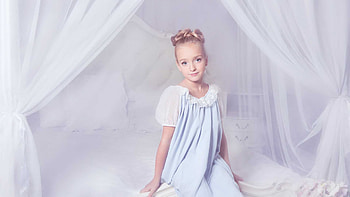 Cute Little Girl Is Sitting On White Bed Wearing Light Blue White Dress Cute HD wallpaper