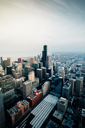 Aerial view of Chicago's skyline featuring the iconic Willis Tower at dusk. HD phone wallpaper