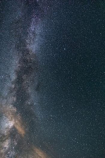 A breathtaking view of the starry night sky showcasing the Milky Way, perfect for space enthusiasts. HD phone wallpaper