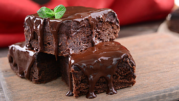 Tempting brownie treat, Rich chocolate goodness, Gooey fudgy delight, Scrumptious visuals HD wallpaper