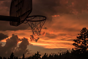 Silhouette of a basketball hoop with vibrant sunset sky in Truckee, CA. HD wallpaper