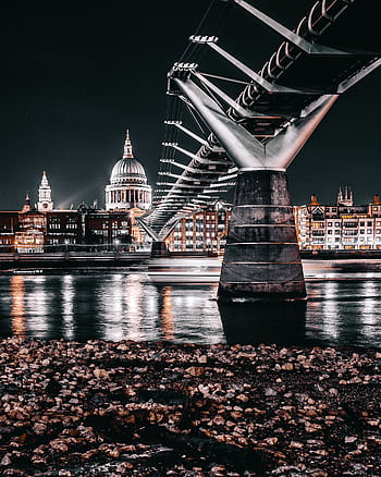 Dramatic night view of London's Millennium Bridge with St. Paul's Cathedral in the backdrop. HD phone wallpaper