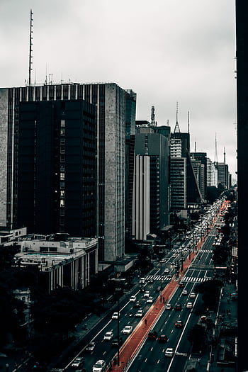 Capture of Avenida Paulista in São Paulo showcasing urban life with towering skyscrapers. HD phone wallpaper