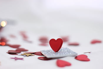 Elegant red heart on sparkly surface, ideal for Valentine's Day themes. HD wallpaper