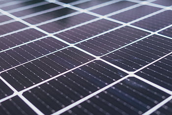 Detailed close-up view of solar panels showcasing renewable energy technology. HD wallpaper