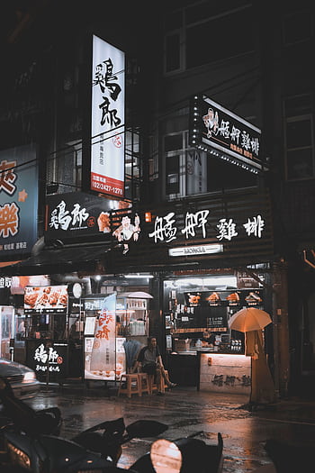 Illuminated food stalls and street life at night in Ren’ai District, Taiwan. HD phone wallpaper