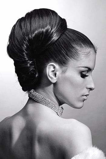 Graceful profile portrait of a woman with elegant hairstyle and necklace. HD phone wallpaper