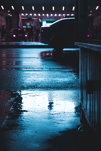 Wet city street reflecting lights in a moody nighttime urban scene. HD phone wallpaper