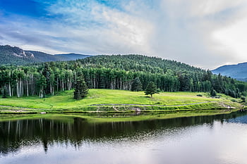 Beautiful summer landscape with lush trees and water reflections in Colorado. HD wallpaper