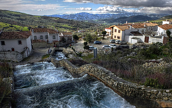 cascading waterfall through a town r, cascading, town, waterfall, r, hill HD wallpaper