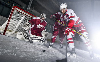 Hockey player playing, Athletic excellence, Skillful puck handling, Dynamic sports graphy HD wallpaper