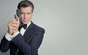 Pierce Brosnan, Dashing spy, Captivating backgrounds, Iconic HD wallpaper