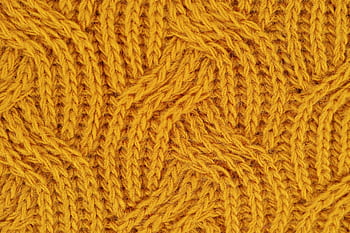Detailed close-up of a yellow knitted wool pattern, ideal for textile design. HD wallpaper