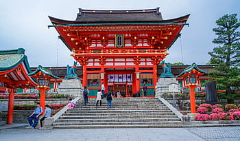 Explore the vibrant architecture of Fushimi Inari Taisha Shrine in Kyoto, Japan. HD wallpaper