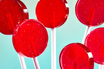 Red hot lollipops, Sweet and spicy blend, Festive treats, Mouthwatering delight HD wallpaper