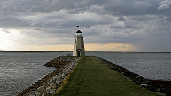 lonely lighthouse on the jetty, sea, clouds, lighthouse, jetty HD wallpaper