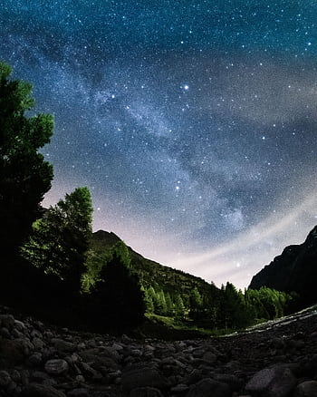 Capture the breathtaking Milky Way over the serene Swiss Alps at night. HD phone wallpaper