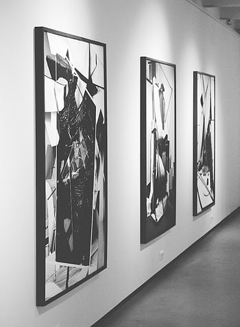 Monochrome abstract paintings on display in a modern art gallery. HD phone wallpaper