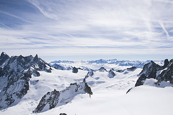 Breathtaking view of Mont Blanc showcasing its icy, rugged peaks under a blue sky HD wallpaper