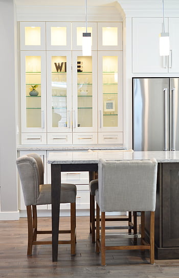 Clean and contemporary kitchen interior with white cabinets and minimalist decor. HD phone wallpaper