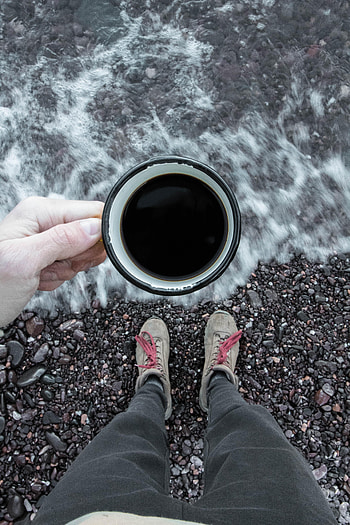 Pebble, Sea, Coffee, Hand, Miscellanea, Miscellaneous, Legs, Cup HD phone wallpaper